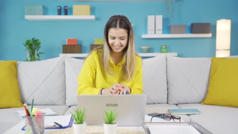 Cheerful-young-business-woman-working-from-home.